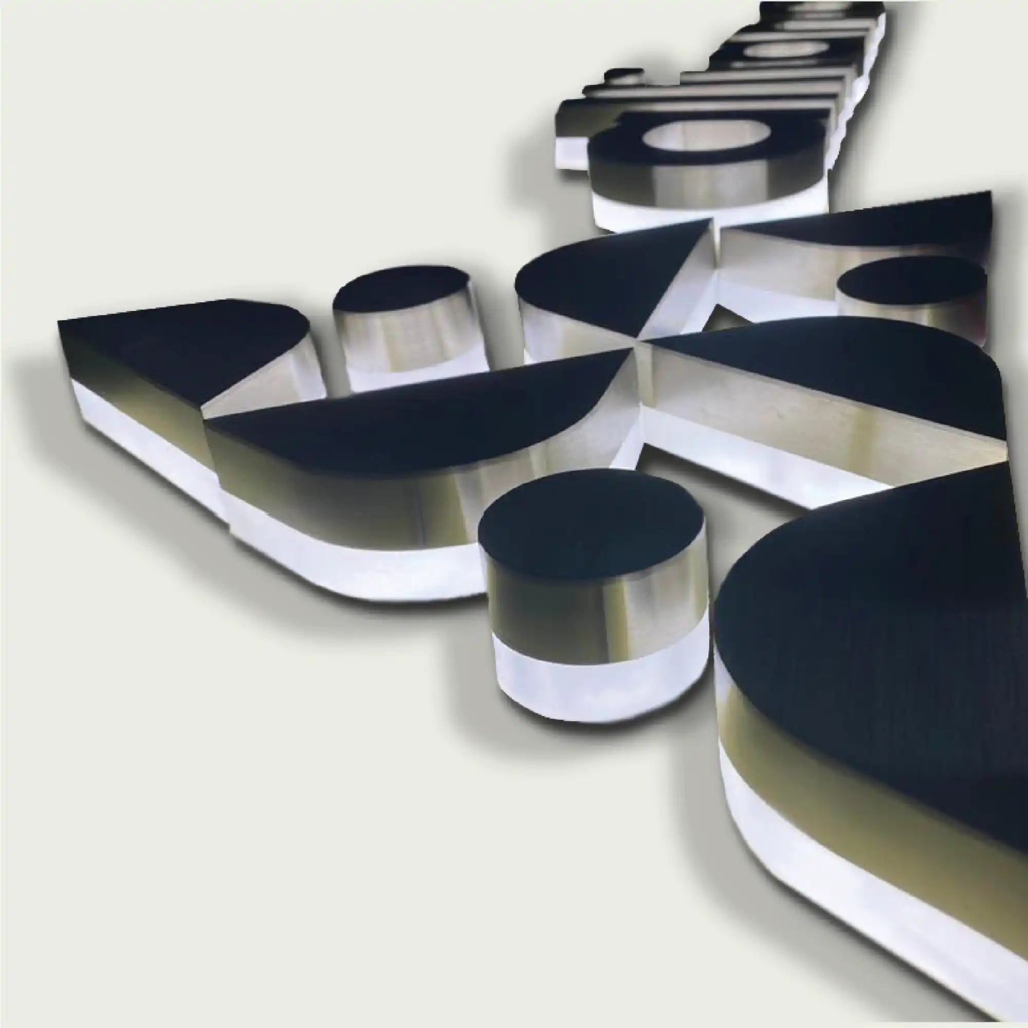 Black and silver three-dimensional letters with white sides.