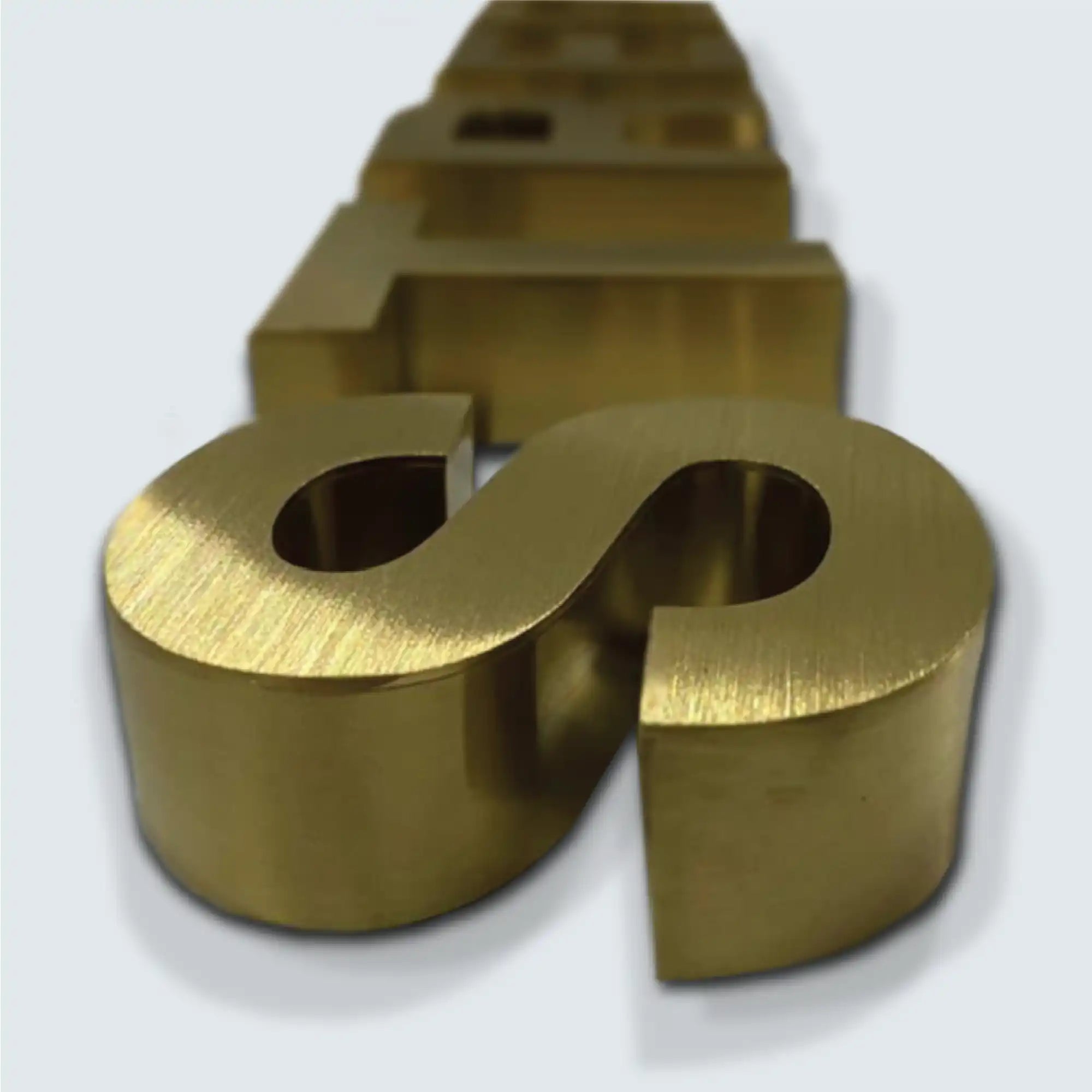 Brushed brass channel letters.