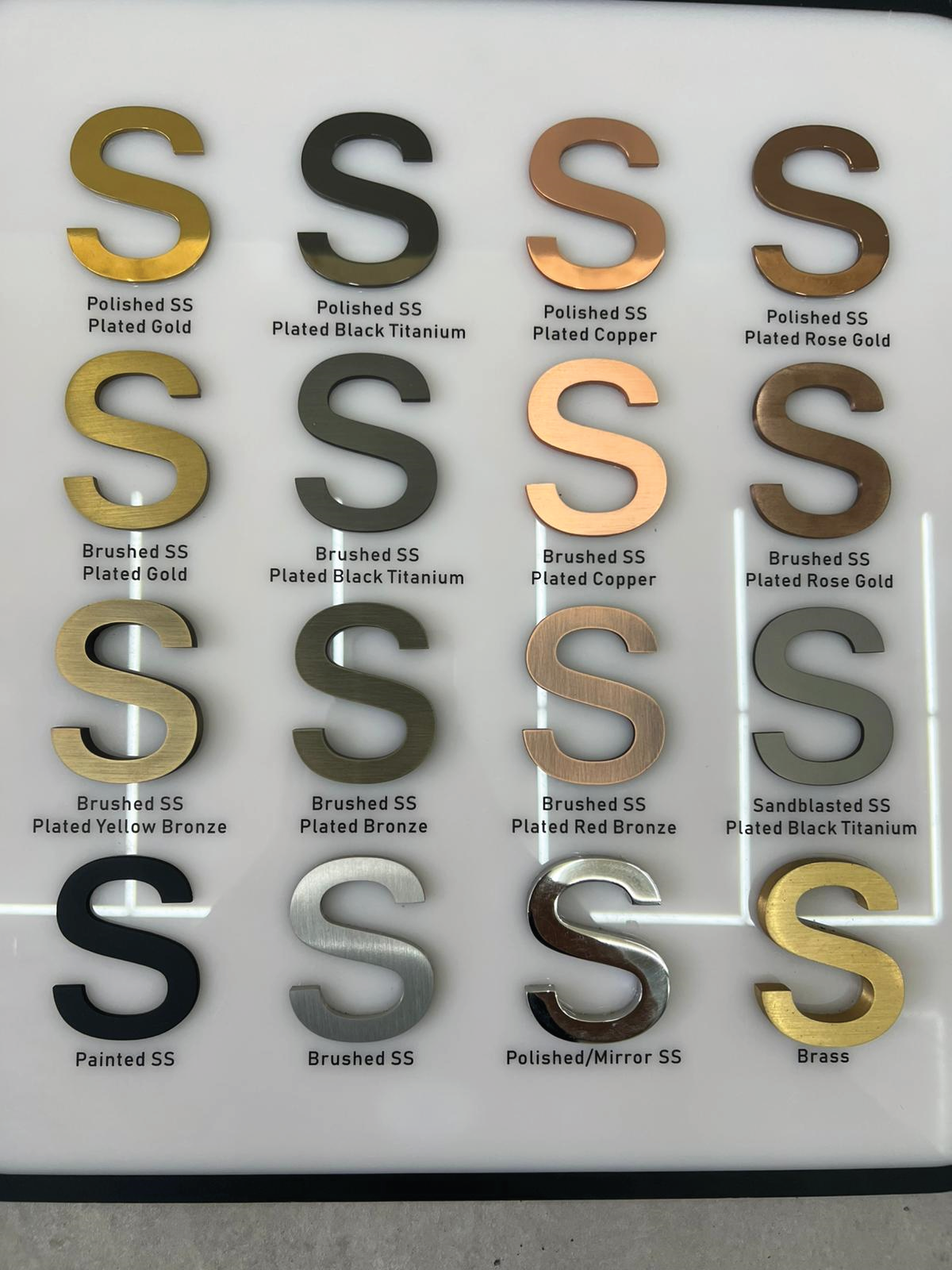 Actual finish sample board showing labelled plated stainless steel finishes and unplated comparison samples
